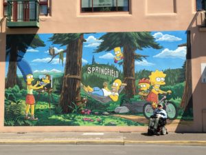 PsychoQuad, David Oaks, in front of the mural in the actual Springfield of The Simpsons